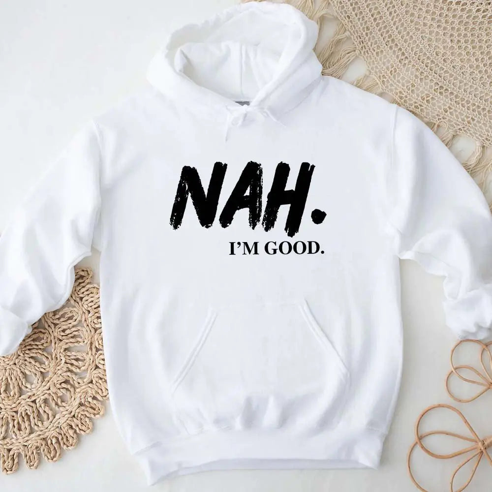 White hoodie with 'NAH. I'M GOOD.' text on a light background