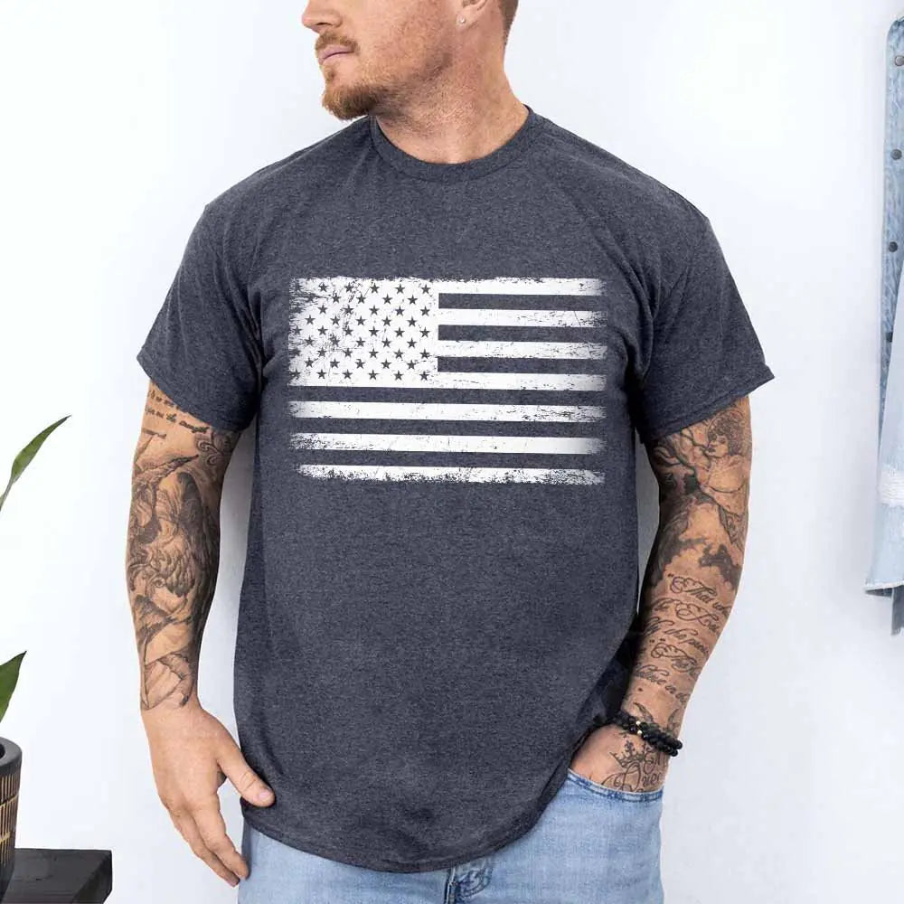 Man wearing a dark gray t-shirt with an American flag design against a white background