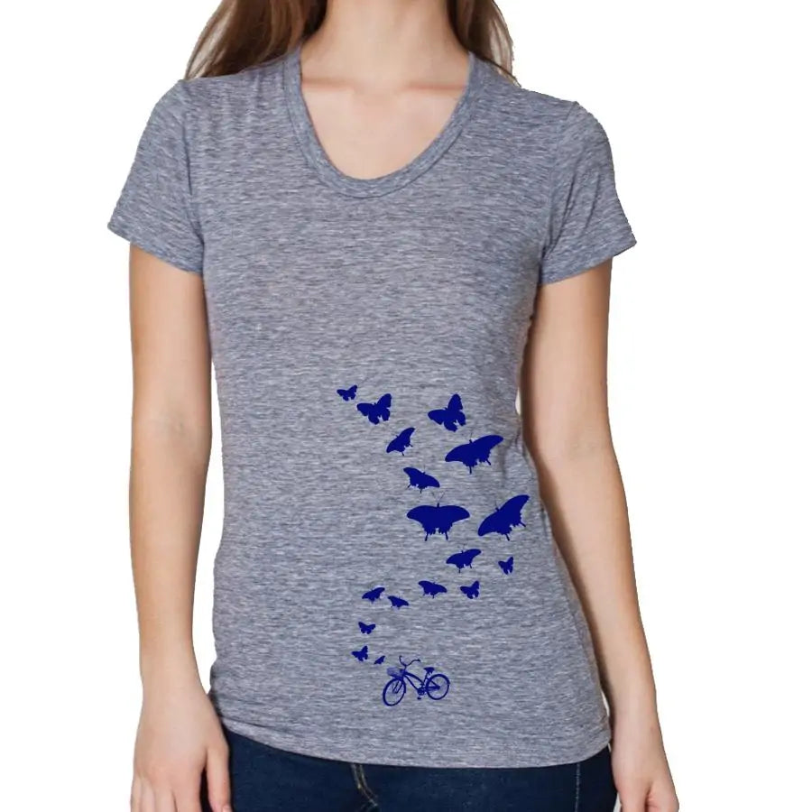 Gray t-shirt with blue butterfly design worn by a person on a white background