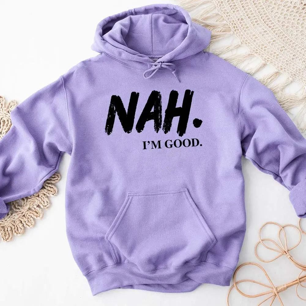 Purple hoodie with 'NAH. I'M GOOD.' text on a textured surface