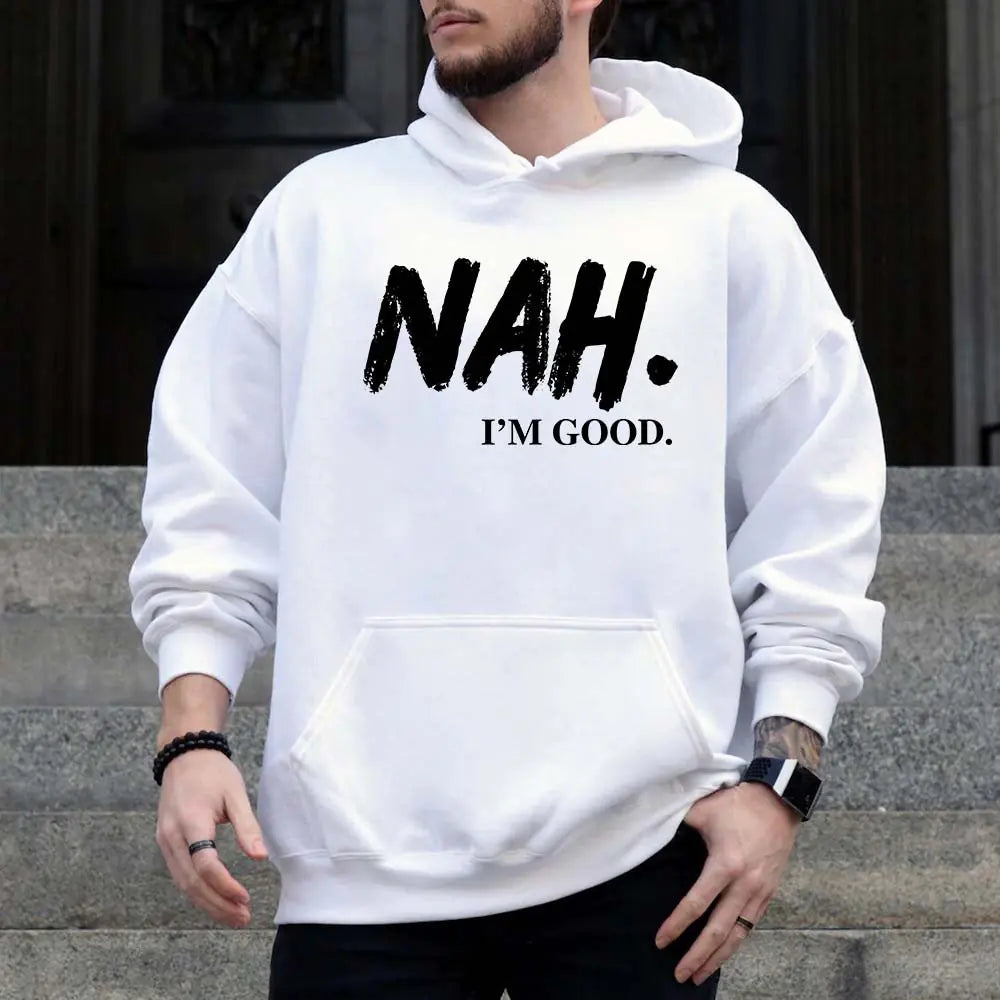 Person wearing a white hoodie with 'NAH. I'M GOOD.' text, standing on steps.